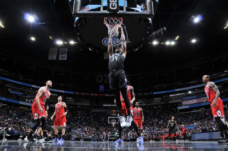 ORLANDO, FL - JANUARY 28: Wendell Carter Jr. #34 of the Orlando Magic drives to the basket during the game against the Chicago Bulls on January 28, 2023 at Amway Center in Orlando, Florida. NOTE TO USER: User expressly acknowledges and agrees that, by downloading and or using this photograph, User is consenting to the terms and conditions of the Getty Images License Agreement. Mandatory Copyright Notice: Copyright 2023 NBAE (Photo by Fernando Medina/NBAE via Getty Images)