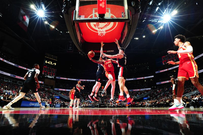 ATLANTA, GA - MARCH 3: Saddiq Bey #41 of the Atlanta Hawks drives to the basket during the game against the Portland Trail Blazers on March 3, 2023 at State Farm Arena in Atlanta, Georgia.  NOTE TO USER: User expressly acknowledges and agrees that, by downloading and/or using this Photograph, user is consenting to the terms and conditions of the Getty Images License Agreement. Mandatory Copyright Notice: Copyright 2023 NBAE (Photo by Scott Cunningham/NBAE via Getty Images)