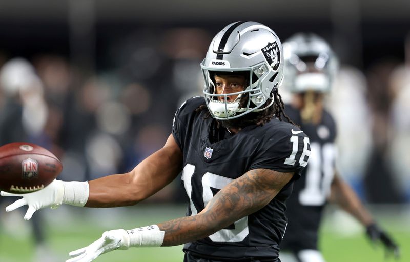 Las Vegas Raiders wide receiver Jakobi Meyers (16) warms up before an NFL football game against the Los Angeles Chargers, Thursday, Dec. 14, 2023, in Las Vegas. (AP Photo/Steve Marcus)