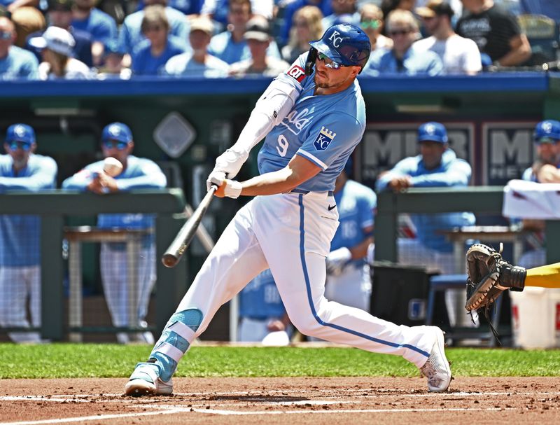 May 8, 2024; Kansas City, Missouri, USA;  Kansas City Royals first baseman Vinnie Pasquantino (9) drives in a run with a sacrifice fly in the first inning against the Milwaukee Brewers at Kauffman Stadium. Mandatory Credit: Peter Aiken-USA TODAY Sports