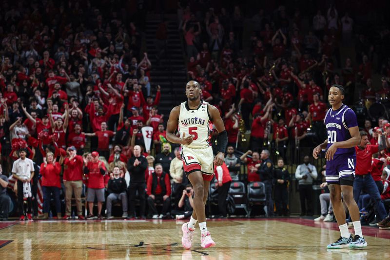 Feb 15, 2024; Piscataway, New Jersey, USA; Rutgers Scarlet Knights forward Aundre Hyatt (5) reacts after making three point basket in front of Northwestern Wildcats guard Justin Mullins (20) during the second half at Jersey Mike's Arena. Mandatory Credit: Vincent Carchietta-USA TODAY Sports