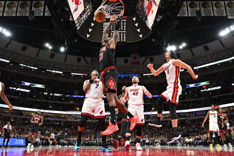 CHICAGO, ILLINOIS - NOVEMBER 18: Torrey Craig #13 of the Chicago Bulls dunks for two points in the second half against the Miami Heat on November 18, 2023 at United Center in Chicago, Illinois. Chicago defeated Miami 102-97. NOTE TO USER: User expressly acknowledges and agrees that, by downloading and or using this photograph, User is consenting to the terms and conditions of the Getty Images License Agreement. (Photo by Jamie Sabau/Getty Images)