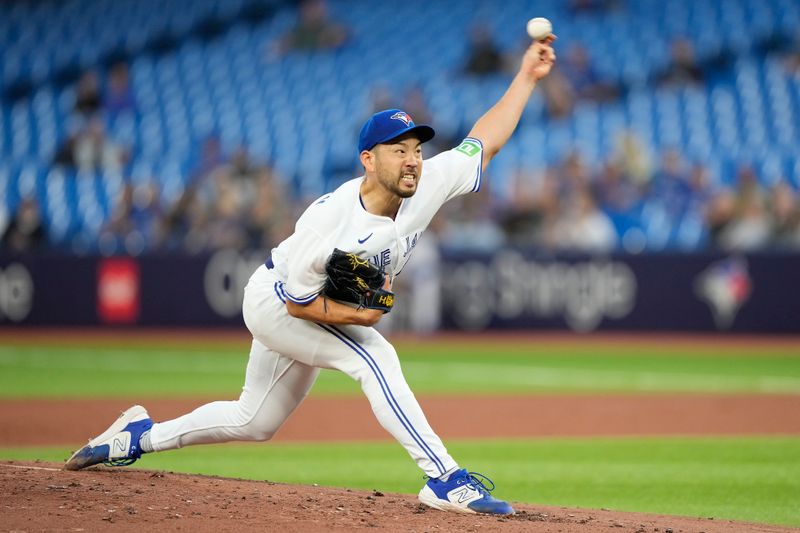 Sep 8, 2023; Toronto, Ontario, CAN; Toronto Blue Jays starting pitcher Yusei Kikuchi (16) pitches to theKansas City Royals during the second inning at Rogers Centre. Mandatory Credit: John E. Sokolowski-USA TODAY Sports