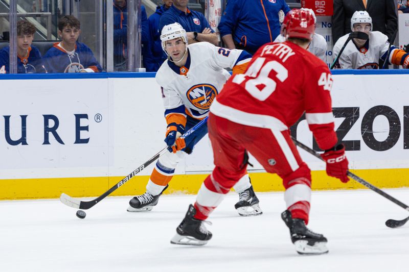 Oct 30, 2023; Elmont, New York, USA; New York Islanders center Kyle Palmieri (21) controls the puck while Detroit Red Wings defenseman Jeff Petry (46) defends during the second period at UBS Arena. Mandatory Credit: Thomas Salus-USA TODAY Sports