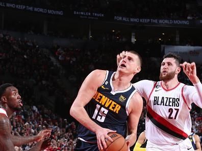 PORTLAND, OR - OCTOBER 24: Nikola Jokic #15 of the Denver Nuggets drives to the basket during the game against the Portland Trail Blazers on October 24, 2022 at the Moda Center Arena in Portland, Oregon. NOTE TO USER: User expressly acknowledges and agrees that, by downloading and or using this photograph, user is consenting to the terms and conditions of the Getty Images License Agreement. Mandatory Copyright Notice: Copyright 2022 NBAE (Photo by Sam Forencich/NBAE via Getty Images)