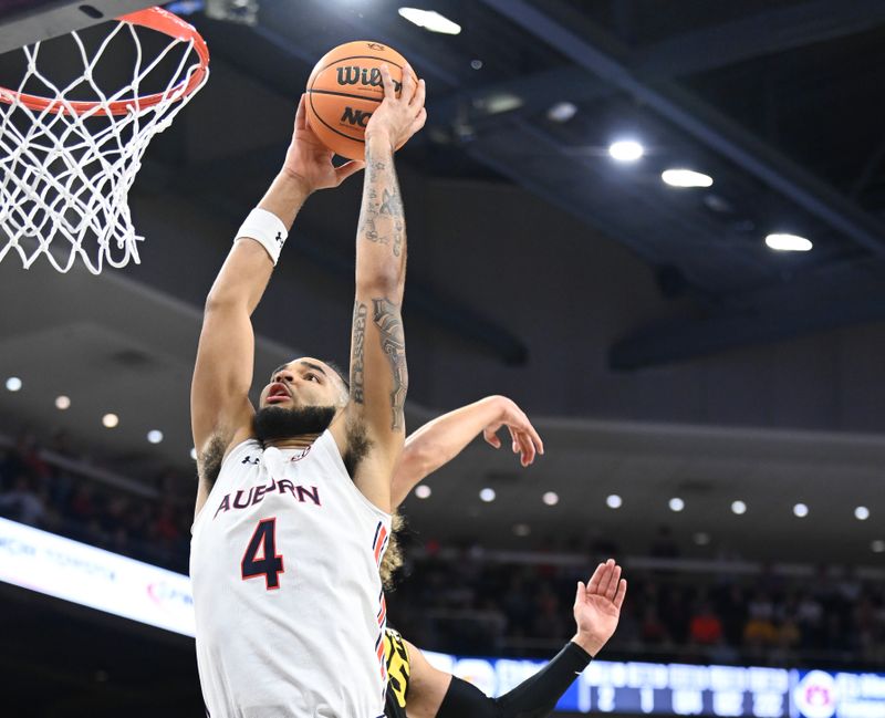 Feb 14, 2023; Auburn, Alabama, USA; Auburn Tigers forward Johni Broome (4) shoots against the Missouri Tigers during the second half at Neville Arena. Mandatory Credit: Julie Bennett-USA TODAY Sports