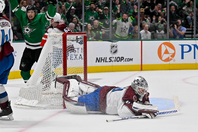 May 15, 2024; Dallas, Texas, USA; Colorado Avalanche goaltender Alexandar Georgiev (40) reacts to giving up a goal to Dallas Stars defenseman Miro Heiskanen (not pictured) as left wing Jason Robertson (21) celebrates during the second period in game five of the second round of the 2024 Stanley Cup Playoffs at American Airlines Center. Mandatory Credit: Jerome Miron-USA TODAY Sports
