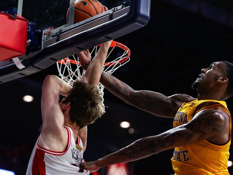 Mar 4, 2025; Tucson, Arizona, USA; Arizona State Sun Devils center Shawn Phillips Jr. (9) blocks Arizona Wildcats forward Henri Veesaar (13) during the second half at McKale Center. Mandatory Credit: Aryanna Frank-Imagn Images