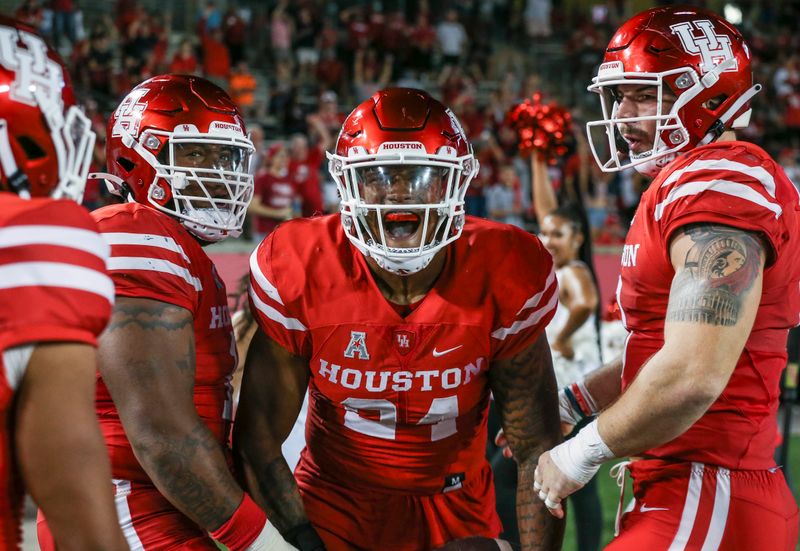 Sep 25, 2021; Houston, Texas, USA; Houston Cougars linebacker Malik Robinson (24) reacts after a Navy Midshipmen turnover during the fourth quarter at TDECU Stadium. Mandatory Credit: Troy Taormina-USA TODAY Sports