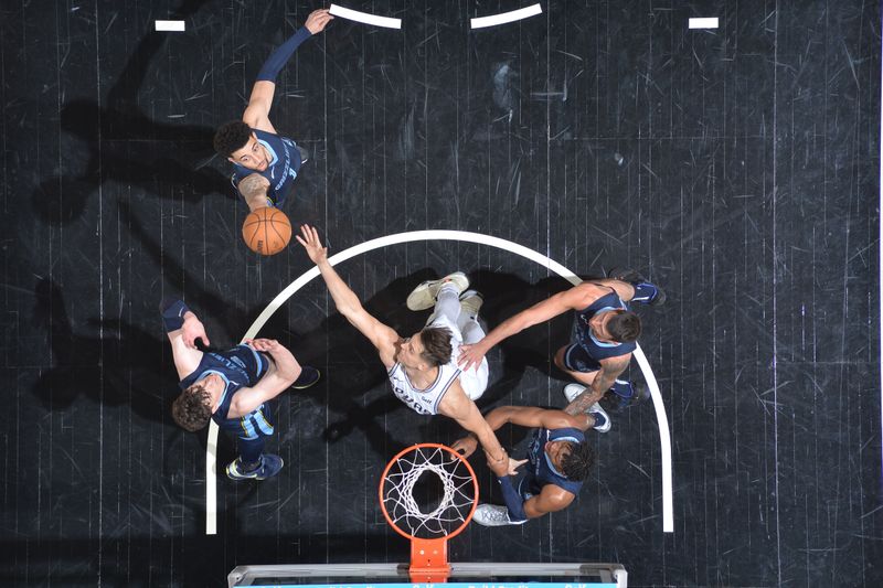 SAN ANTONIO, TX - MARCH 22  Scotty Pippen Jr. #1 of the Memphis Grizzlies  and Zach Collins #23 of the San Antonio Spurs battle for a rebound on March 22, 2024 at the Frost Bank Center in San Antonio, Texas. NOTE TO USER: User expressly acknowledges and agrees that, by downloading and or using this photograph, user is consenting to the terms and conditions of the Getty Images License Agreement. Mandatory Copyright Notice: Copyright 2024 NBAE (Photos by Michael Gonzales/NBAE via Getty Images)