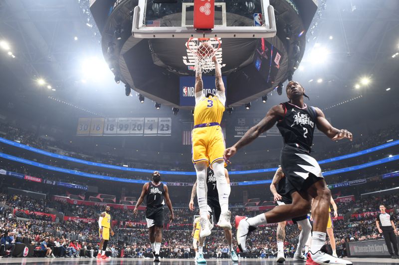 LOS ANGELES, CA - FEBRUARY 28: Anthony Davis #3 of the Los Angeles Lakers dunks the ball during the game against the LA Clippers on February 28, 2024 at Crypto.Com Arena in Los Angeles, California. NOTE TO USER: User expressly acknowledges and agrees that, by downloading and/or using this Photograph, user is consenting to the terms and conditions of the Getty Images License Agreement. Mandatory Copyright Notice: Copyright 2024 NBAE (Photo by Andrew D. Bernstein/NBAE via Getty Images)