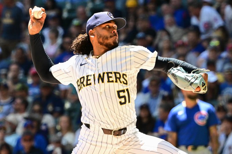 Jun 30, 2024; Milwaukee, Wisconsin, USA; Milwaukee Brewers starting pitcher Freddy Peralta (51) throws a pitch against the Chicago Cubs in the first inning at American Family Field. Mandatory Credit: Benny Sieu-USA TODAY Sports