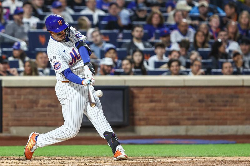 Aug 20, 2024; New York City, New York, USA;  New York Mets third baseman Mark Vientos (27) hits an RBI double in the third inning against the Baltimore Orioles at Citi Field. Mandatory Credit: Wendell Cruz-USA TODAY Sports