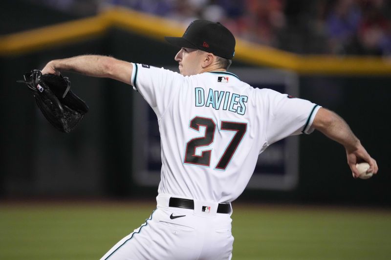 Jun 18, 2023; Phoenix, Arizona, USA; Arizona Diamondbacks starting pitcher Zach Davies (27) pitches against the Cleveland Guardians during the first inning at Chase Field. Mandatory Credit: Joe Camporeale-USA TODAY Sports