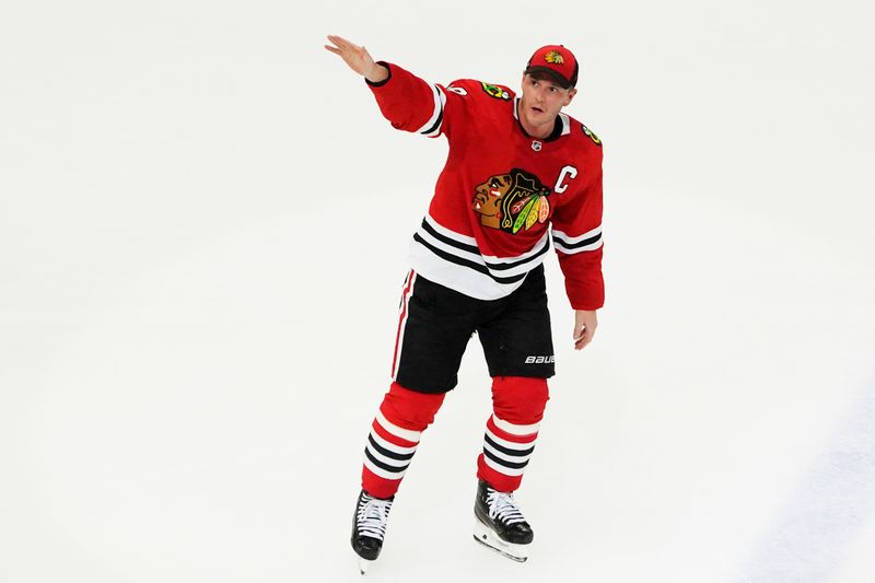 Apr 13, 2023; Chicago, Illinois, USA; Chicago Blackhawks center Jonathan Toews (19) is honored after the game against the Philadelphia Flyers. He played his last game as a Blackhawk, at United Center. Mandatory Credit: David Banks-USA TODAY Sports