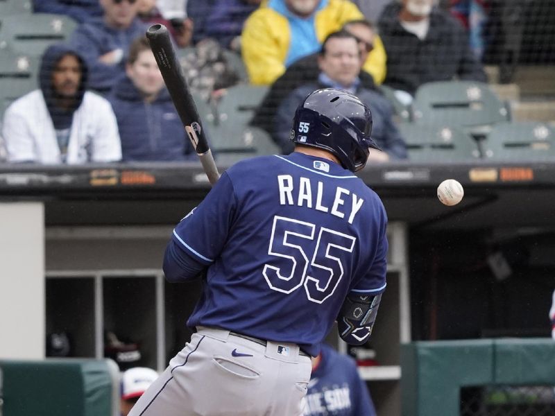 Apr 30, 2023; Chicago, Illinois, USA; Tampa Bay Rays first baseman Luke Raley (55) is hit by a pitch during the sixth inning at Guaranteed Rate Field. Mandatory Credit: David Banks-USA TODAY Sports