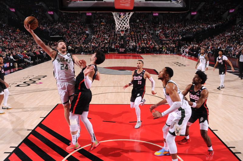 PORTLAND, OR - JANUARY 28: Pat Connaughton #24 of the Milwaukee Bucks drives to the basket during the game against the Portland Trail Blazers on January 28, 2025 at the Moda Center Arena in Portland, Oregon. NOTE TO USER: User expressly acknowledges and agrees that, by downloading and or using this photograph, user is consenting to the terms and conditions of the Getty Images License Agreement. Mandatory Copyright Notice: Copyright 2025 NBAE (Photo by Cameron Browne/NBAE via Getty Images)