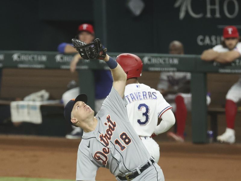 Jun 28, 2023; Arlington, Texas, USA;  Detroit Tigers first baseman Tyler Nevin (18) catches a ball to retire Texas Rangers center fielder Leody Taveras (3) during the fifth inning at Globe Life Field. Mandatory Credit: Kevin Jairaj-USA TODAY Sports