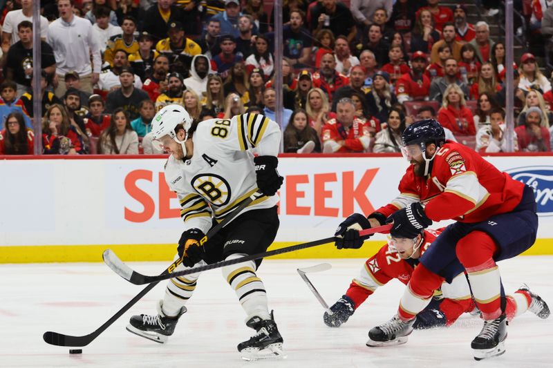 May 6, 2024; Sunrise, Florida, USA; Boston Bruins right wing David Pastrnak (88) moves the puck past Florida Panthers defenseman Aaron Ekblad (5) during the third period in game one of the second round of the 2024 Stanley Cup Playoffs at Amerant Bank Arena. Mandatory Credit: Sam Navarro-USA TODAY Sports