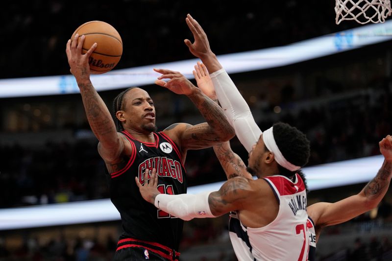 CHICAGO, ILLINOIS - MARCH 25: DeMar DeRozan #11 of the Chicago Bulls drives to the basket against Richaun Holmes #22 of the Washington Wizards during the second half at the United Center on March 25, 2024 in Chicago, Illinois. NOTE TO USER: User expressly acknowledges and agrees that, by downloading and or using this photograph, User is consenting to the terms and conditions of the Getty Images License Agreement. (Photo by Patrick McDermott/Getty Images)