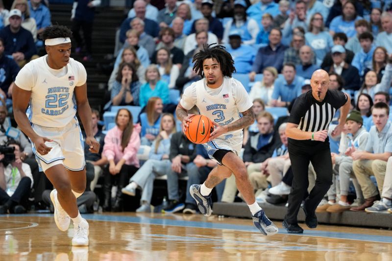 Jan 18, 2025; Chapel Hill, North Carolina, USA; North Carolina Tar Heels guard Elliot Cadeau (3) brings the ball up the court in the second half at Dean E. Smith Center. Mandatory Credit: Bob Donnan-Imagn Images