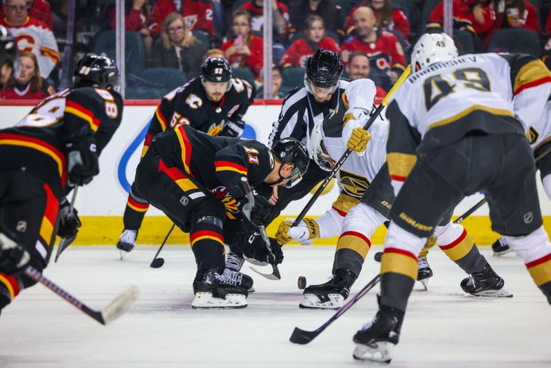 Mar 14, 2024; Calgary, Alberta, CAN; Calgary Flames center Mikael Backlund (11) and Vegas Golden Knights center Jack Eichel (9) face off for the puck during the first period at Scotiabank Saddledome. Mandatory Credit: Sergei Belski-USA TODAY Sports