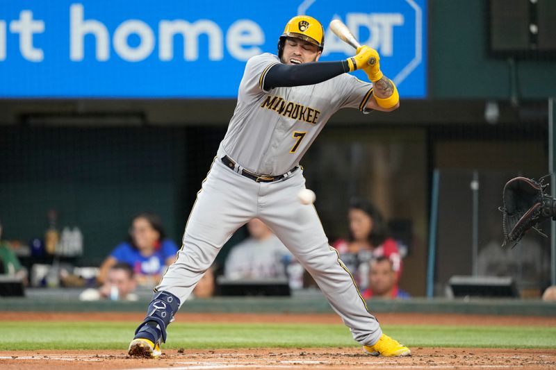 Aug 20, 2023; Arlington, Texas, USA; Milwaukee Brewers catcher Victor Caratini (7) reacts to an inside pitch thrown by Texas Rangers starting pitcher Max Scherzer (not shown) during the first inning at Globe Life Field. Mandatory Credit: Jim Cowsert-USA TODAY Sports