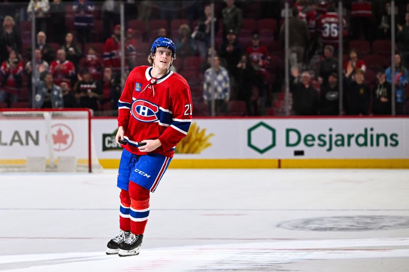 Oct 28, 2023; Montreal, Quebec, CAN; Montreal Canadiens defenseman Kaiden Guhle (21), first star of the night, skates saluting the crowd after the end of the game at Bell Centre. Mandatory Credit: David Kirouac-USA TODAY Sports