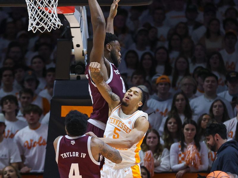 Feb 24, 2024; Knoxville, Tennessee, USA; Tennessee Volunteers guard Zakai Zeigler (5) is fouled by Texas A&M Aggies during the first half at Thompson-Boling Arena at Food City Center. Mandatory Credit: Randy Sartin-USA TODAY Sports