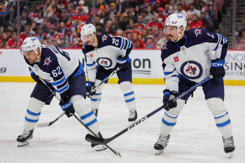 Nov 24, 2023; Sunrise, Florida, USA; Winnipeg Jets right wing Nino Niederreiter (62) and defenseman Dylan DeMelo (2) look on against the Florida Panthers during the second period at Amerant Bank Arena. Mandatory Credit: Sam Navarro-USA TODAY Sports