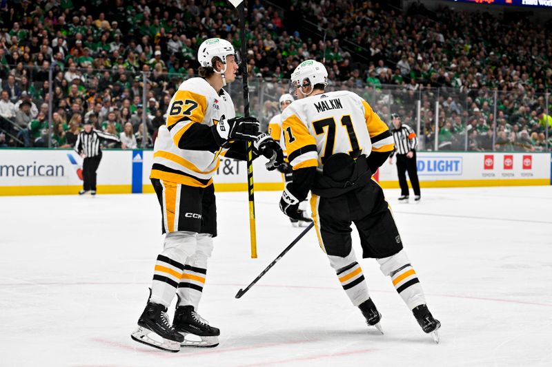 Mar 22, 2024; Dallas, Texas, USA; Pittsburgh Penguins right wing Rickard Rakell (67) and center Evgeni Malkin (71) celebrates a goal scored by Rakell against the Dallas Stars during the third period at the American Airlines Center. Mandatory Credit: Jerome Miron-USA TODAY Sports