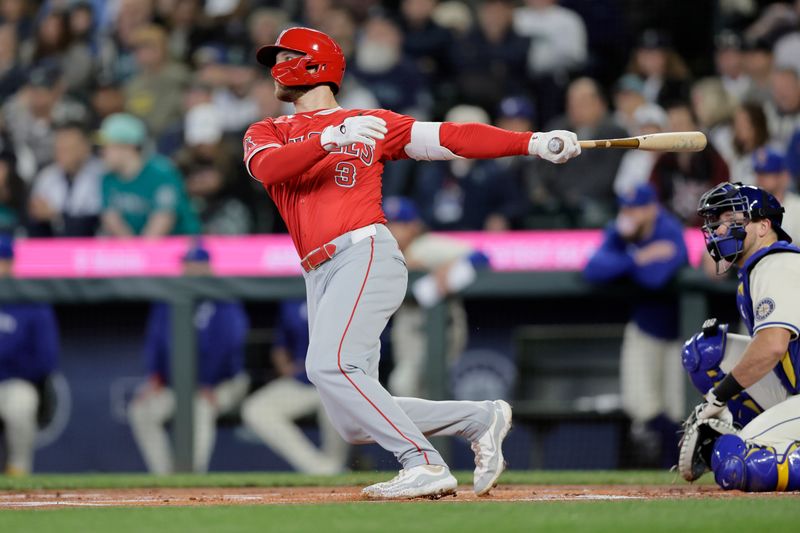 Jun 2, 2024; Seattle, Washington, USA;  Los Angeles Angels designated hitter Taylor Ward (3) hits a double against the Seattle Mariners during the first inning at T-Mobile Park. Mandatory Credit: John Froschauer-USA TODAY Sports