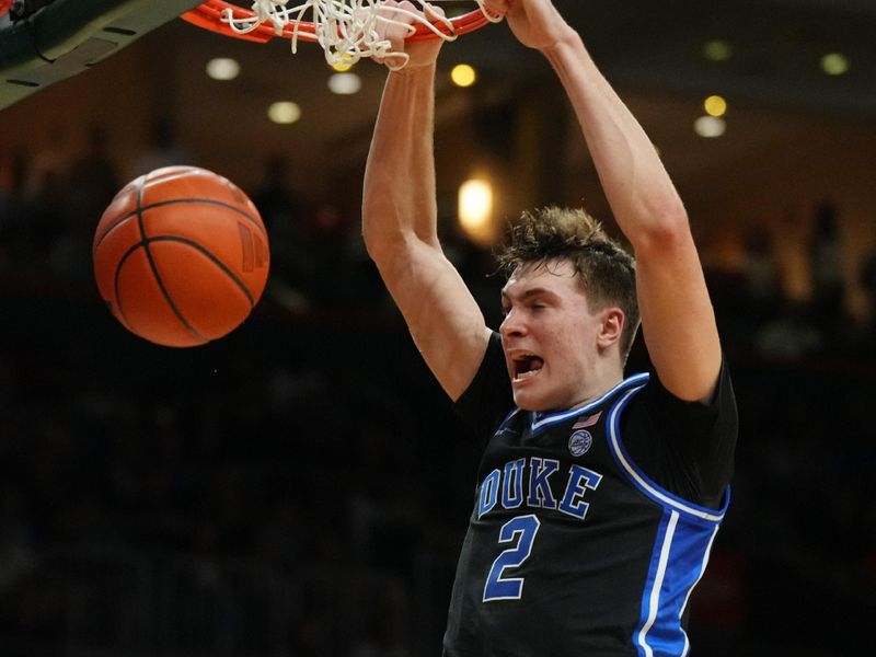 Feb 25, 2025; Coral Gables, Florida, USA;  Duke Blue Devils guard Cooper Flagg (2) puts away a dunk against the Miami (Fl) Hurricanes during the first half at Watsco Center. Mandatory Credit: Jim Rassol-Imagn Images