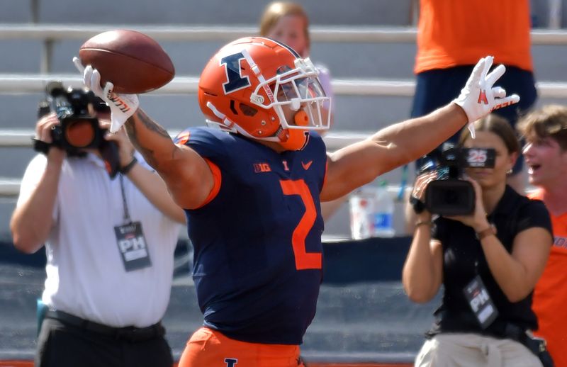 Aug 27, 2022; Champaign, Illinois, USA;  Illinois Fighting Illini running back Chase Brown (2) reacts after scoring a touchdown in the first half against Wyoming  at Memorial Stadium. Mandatory Credit: Ron Johnson-USA TODAY Sports