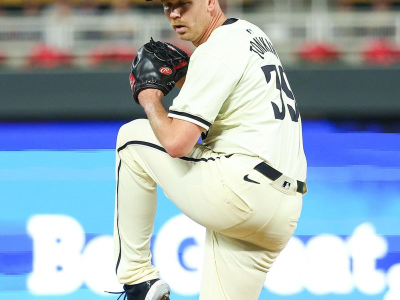 Aug 28, 2024; Minneapolis, Minnesota, USA; Minnesota Twins relief pitcher Michael Tonkin (39) delivers a pitch against the Atlanta Braves during the eighth inning at Target Field. Mandatory Credit: Matt Krohn-USA TODAY Sports