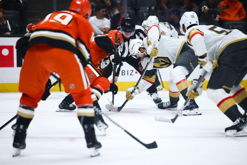 Nov 13, 2024; Anaheim, California, USA; Vegas Golden Knights right wing Cole Schwindt (22) and Anaheim Ducks center Trevor Zegras (11) face off during the first period of a hockey game at Honda Center. Mandatory Credit: Jessica Alcheh-Imagn Images