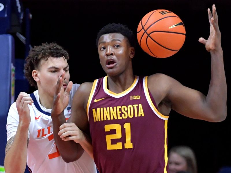 Feb 28, 2024; Champaign, Illinois, USA; Minnesota Golden Gophers forward Pharrel Payne (21) loses a handle on the ball as he is pressured by Illinois Fighting Illini forward Coleman Hawkins (33) during the first half at State Farm Center. Mandatory Credit: Ron Johnson-USA TODAY Sports