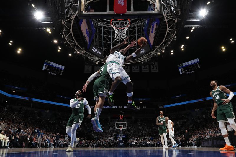 MINNEAPOLIS, MN -  FEBRUARY 23: Anthony Edwards #5 of the Minnesota Timberwolves drives to the basket during the game against the Milwaukee Bucks on February 23, 2024 at Target Center in Minneapolis, Minnesota. NOTE TO USER: User expressly acknowledges and agrees that, by downloading and or using this Photograph, user is consenting to the terms and conditions of the Getty Images License Agreement. Mandatory Copyright Notice: Copyright 2024 NBAE (Photo by Jordan Johnson/NBAE via Getty Images)