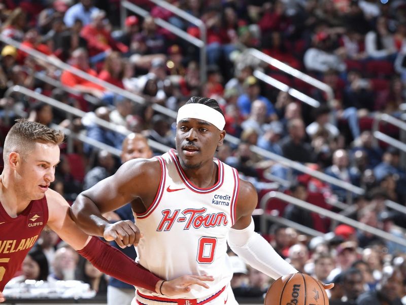 HOUSTON, TX - MARCH 16: Aaron Holiday #0 of the Houston Rockets dribbles the ball during the game against the Cleveland Cavaliers  on March 16, 2023 at the Toyota Center in Houston, Texas. NOTE TO USER: User expressly acknowledges and agrees that, by downloading and or using this photograph, User is consenting to the terms and conditions of the Getty Images License Agreement. Mandatory Copyright Notice: Copyright 2024 NBAE (Photo by Logan Riely/NBAE via Getty Images)