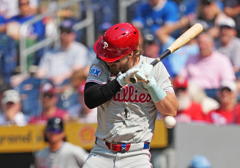 Sep 4, 2024; Toronto, Ontario, CAN; Philadelphia Phillies first baseman Bryce Harper (3) gets hit with a pitch against the Toronto Blue Jays during the first inning at Rogers Centre. Mandatory Credit: Nick Turchiaro-Imagn Images