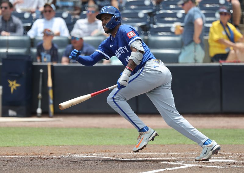May 1, 2025; St. Petersburg, Florida, USA; Kansas City Royals third base Maikel Garcia (11) singles against the Tampa Bay Rays during the second inning  at George M. Steinbrenner Field. Mandatory Credit: Kim Klement Neitzel-Imagn Images