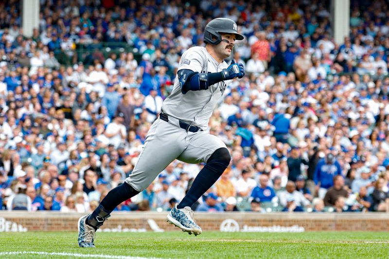 Sep 6, 2024; Chicago, Illinois, USA; New York Yankees catcher Austin Wells (28) runs to first base after hitting a two-run single against the Chicago Cubs during the third inning at Wrigley Field. Mandatory Credit: Kamil Krzaczynski-Imagn Images