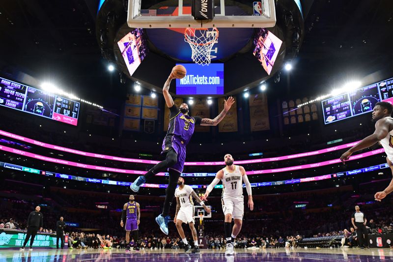 LOS ANGELES, CA - FEBRUARY 9:  Anthony Davis #3 of the Los Angeles Lakers drives to the basket during the game against the New Orleans Pelicans on February 9, 2024 at Crypto.Com Arena in Los Angeles, California. NOTE TO USER: User expressly acknowledges and agrees that, by downloading and/or using this Photograph, user is consenting to the terms and conditions of the Getty Images License Agreement. Mandatory Copyright Notice: Copyright 2024 NBAE (Photo by Adam Pantozzi/NBAE via Getty Images)