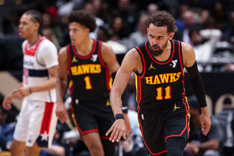 WASHINGTON, DC - OCTOBER 30: Trae Young #11 of the Atlanta Hawks reacts after making a basket against the Washington Wizards during the first half at Capital One Arena on October 30, 2024 in Washington, DC. NOTE TO USER: User expressly acknowledges and agrees that, by downloading and or using this photograph, User is consenting to the terms and conditions of the Getty Images License Agreement. (Photo by Scott Taetsch/Getty Images)