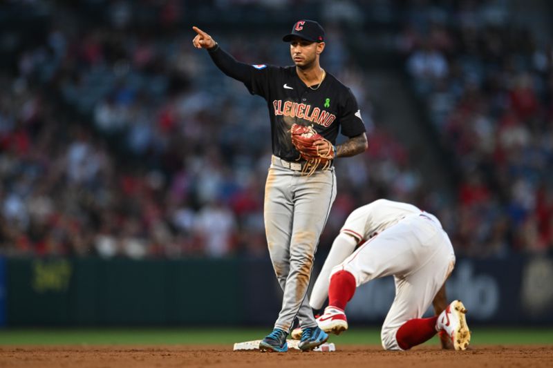 May 25, 2024; Anaheim, California, USA; Cleveland Guardians shortstop Brayan Rocchio (4) reacts after forcing out Los Angeles Angels outfielder Jo Adell (7) during the fourth inning at Angel Stadium. Mandatory Credit: Jonathan Hui-USA TODAY Sports