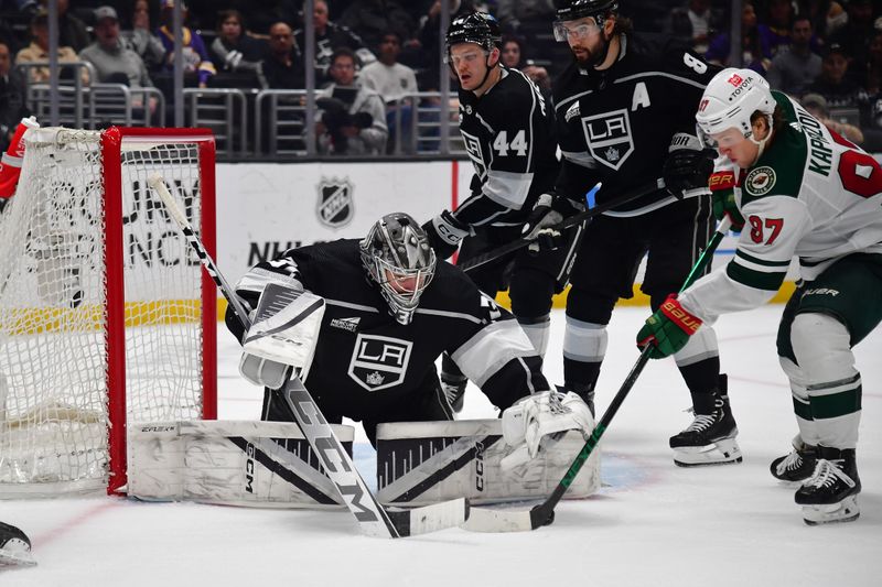 Mar 20, 2024; Los Angeles, California, USA; Los Angeles Kings goaltender David Rittich (31) defends the goal against Minnesota Wild left wing Kirill Kaprizov (97) during the third period at Crypto.com Arena. Mandatory Credit: Gary A. Vasquez-USA TODAY Sports