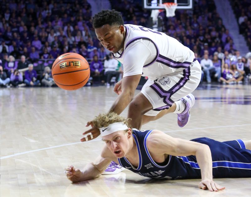Feb 24, 2024; Manhattan, Kansas, USA; Kansas State Wildcats guard Tylor Perry (2) and Brigham Young Cougars guard Richie Saunders (15) go after a loose ball during the first half at Bramlage Coliseum. Mandatory Credit: Scott Sewell-USA TODAY Sports