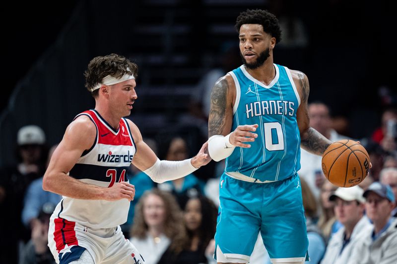 CHARLOTTE, NORTH CAROLINA - FEBRUARY 03: Corey Kispert #24 of the Washington Wizards guards Miles Bridges #0 of the Charlotte Hornets in the third quarter at Spectrum Center on February 03, 2025 in Charlotte, North Carolina. NOTE TO USER: User expressly acknowledges and agrees that, by downloading and or using this photograph, User is consenting to the terms and conditions of the Getty Images License Agreement. (Photo by Jacob Kupferman/Getty Images)