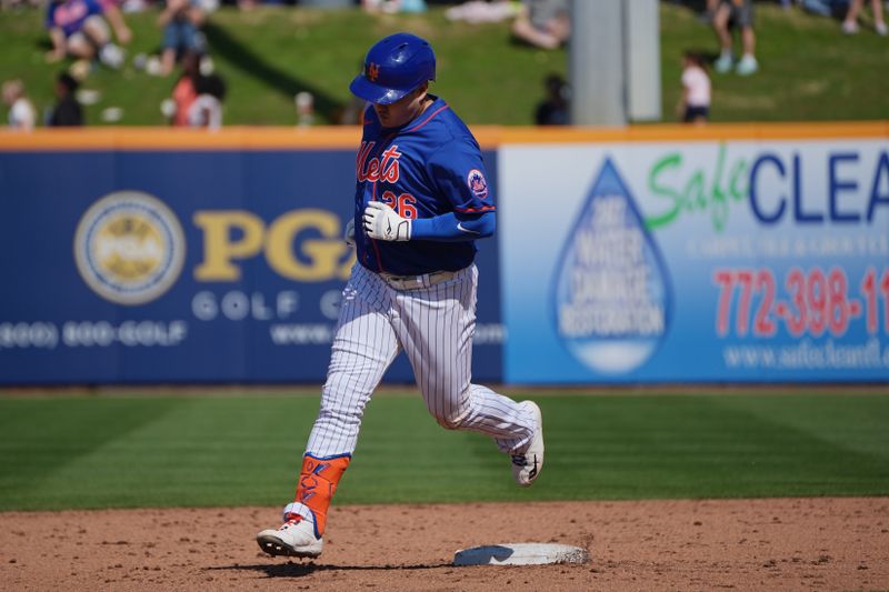 Feb 27, 2024; Port St. Lucie, Florida, USA;  New York Mets first baseman Ji-Man Choi (26) rounds the bases after hitting a solo home run in the sixth inning against the Miami Marlins at Clover Park. Mandatory Credit: Jim Rassol-USA TODAY Sports