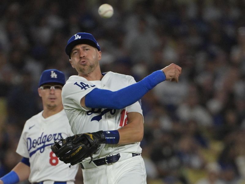 Jul 24, 2024; Los Angeles, California, USA;   Los Angeles Dodgers shortstop Nick Ahmed (12) throws San Francisco Giants designated hitter Jorge Soler (2) out at first in the eighth inning at Dodger Stadium. Mandatory Credit: Jayne Kamin-Oncea-USA TODAY Sports